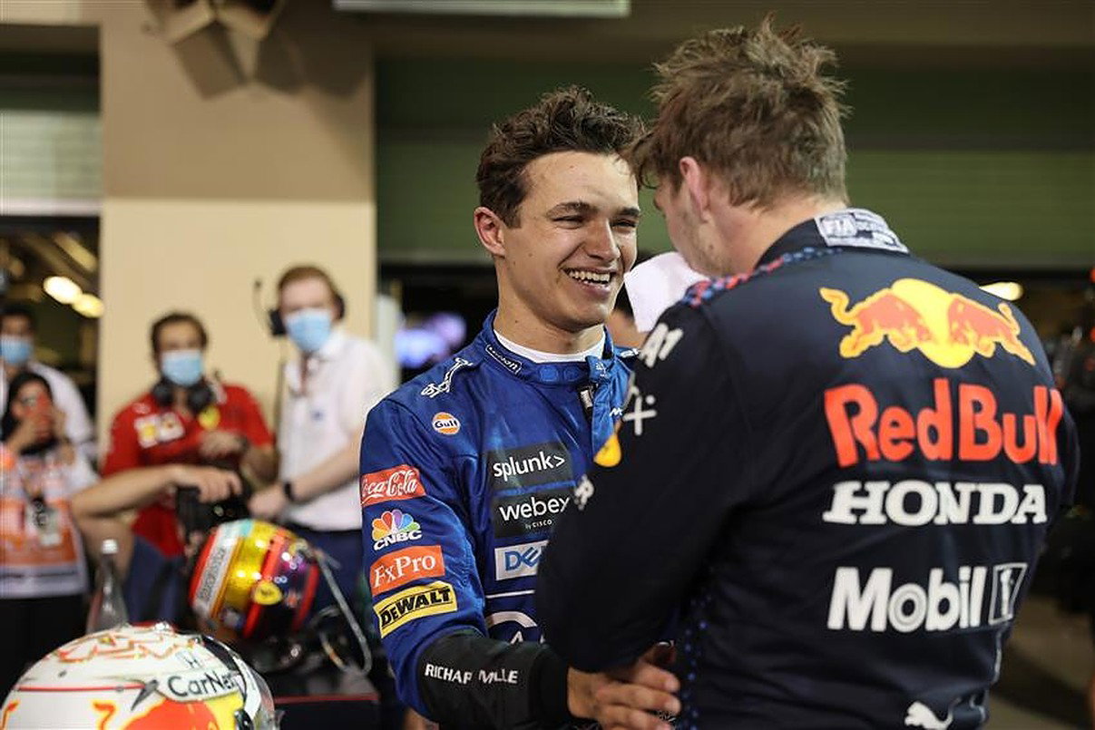 Lando Norris congratulates Max Verstappen after beating Lewis Hamilton in Abu Dhabi.v1