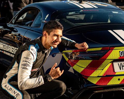 Esteban Ocon with an Alpine French police car.v1